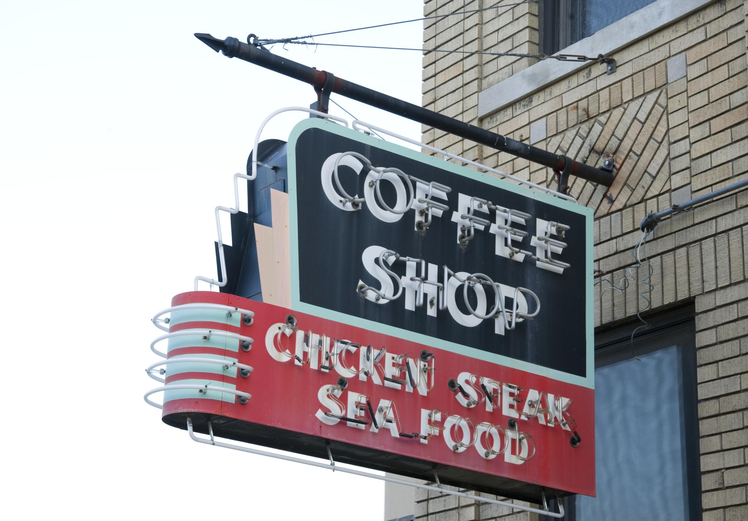 A neon sign reading COFFEE SHOP, CHICKEN, STEAK, SEA FOOD, near the Lorraine Motel in Memphis, 2006.