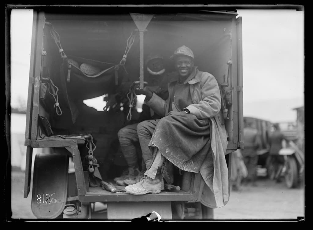 Wounded Black American soldiers arriving by ambulance at American Red Cross Hospital No. 5, Auteuil, 1918.