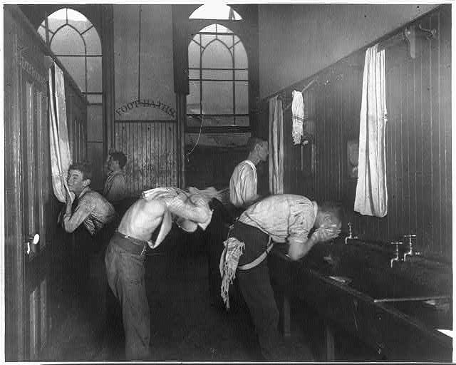 Washing up in the newsboys' lodging house, one of the Society's houses in the city.
