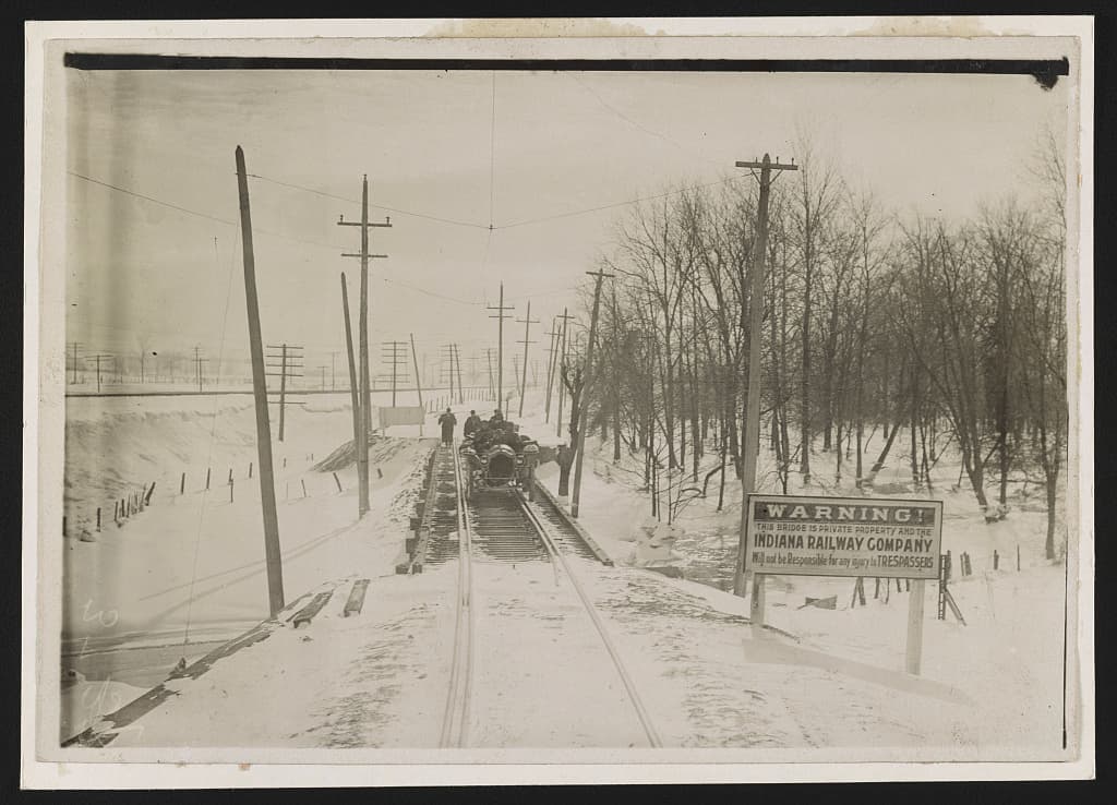 The Thomas Flyer driven along a railroad track in Indiana that winter.
