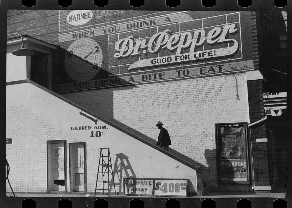 Belzoni, Mississippi, 1939. The side entrance of the Crescent Theatre, marked COLORED ADM 10 cents.