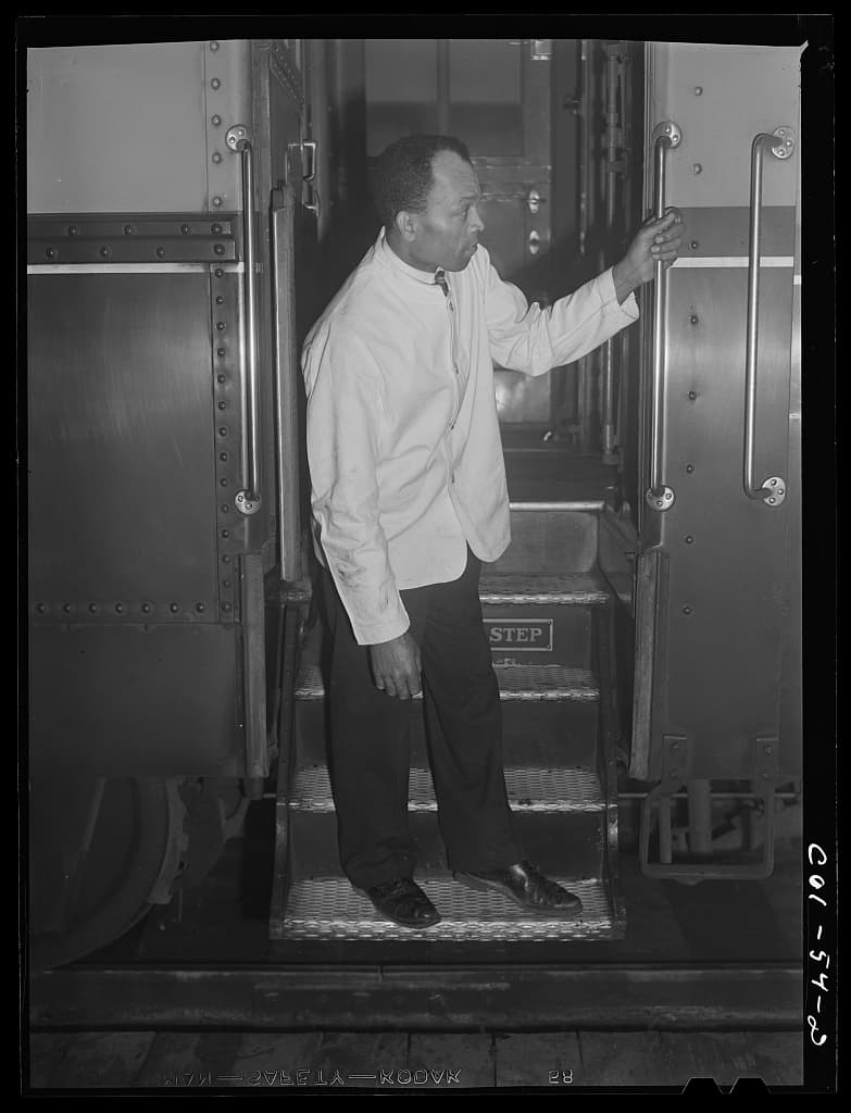Alfred MacMillian, Pullman porter, waiting for the train to start aboard the Capitol Limited, March 1942.