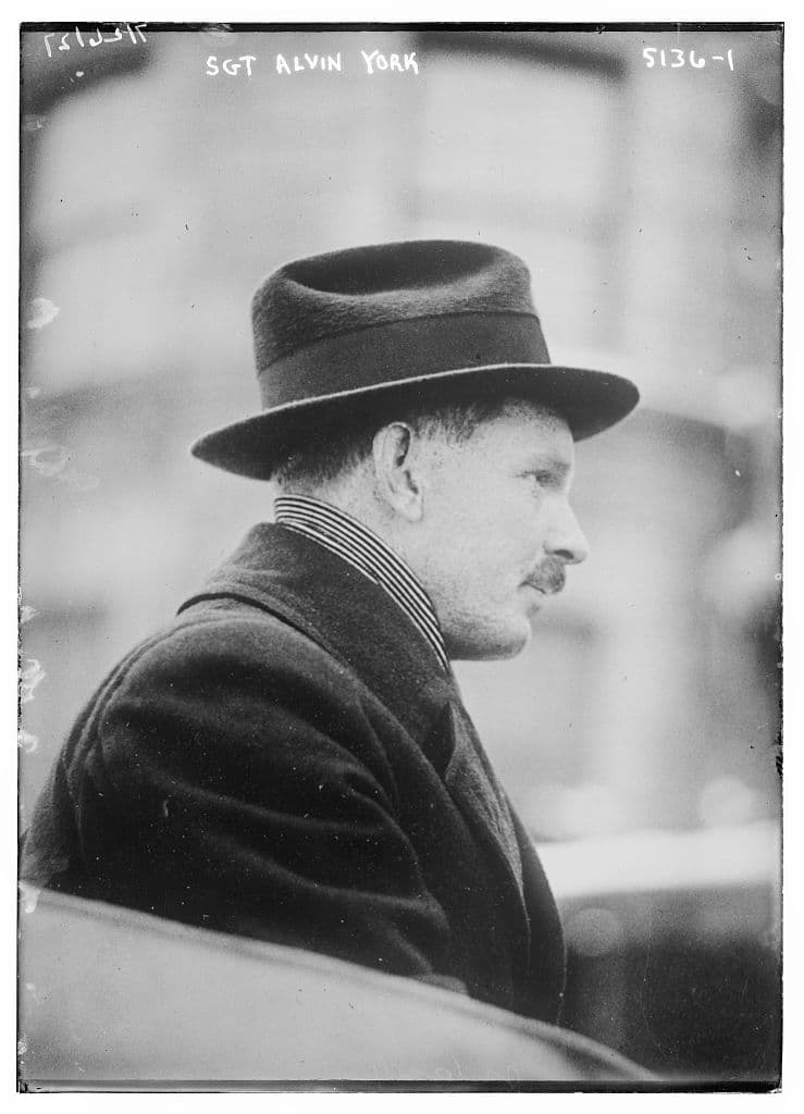 York in civilian clothes and hat, from the same news agency file.