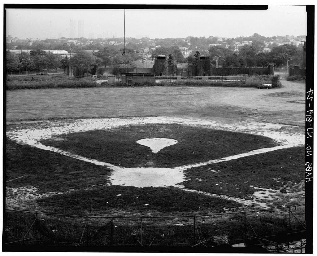 The baseball diamond, looking east. Home plate is still there under the weeds.