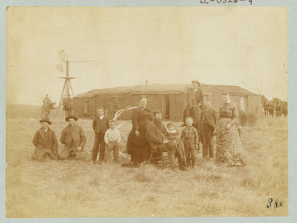 A sod house in Dry Valley near Comstock, Nebraska, 1887. The Library puts a question mark on the family name.