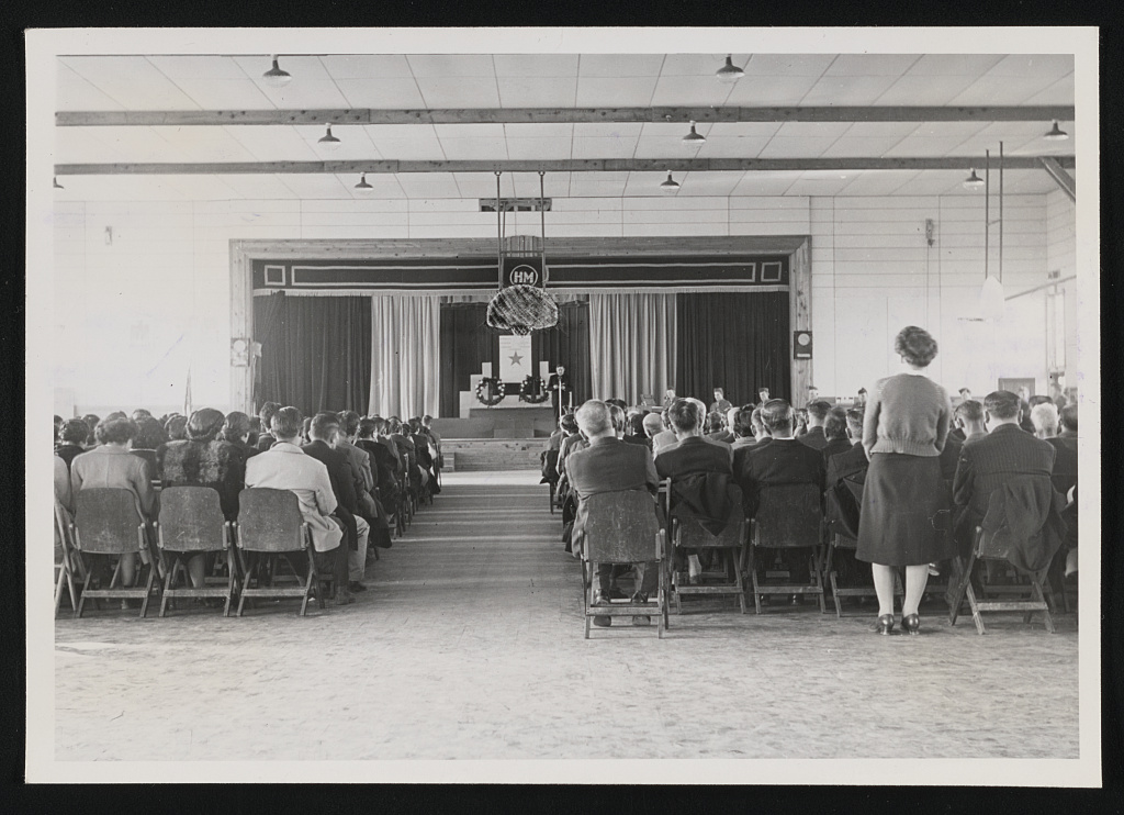 Memorial services in the high school auditorium, 9 December 1944, for six men killed in France.
