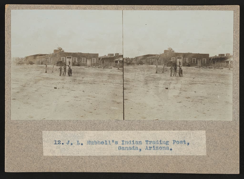 J. L. Hubbell's trading post at Ganado in 1905, on a stereograph card. Two frames, one view.