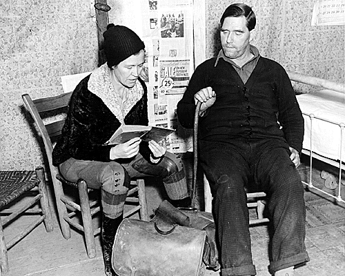 A pack horse librarian reading aloud to a man in the Kentucky mountains, 1938.