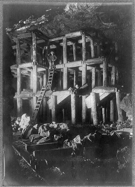 Timbers at the 200-foot level, photographed underground by flashlight about 1908.