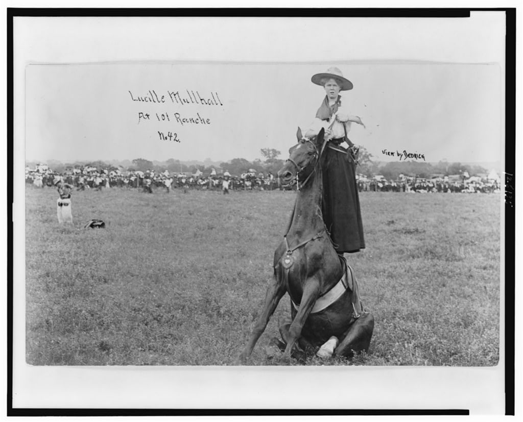 Lucille Mulhall standing on her horse at the 101 Ranch, in a photograph copyrighted 1909.