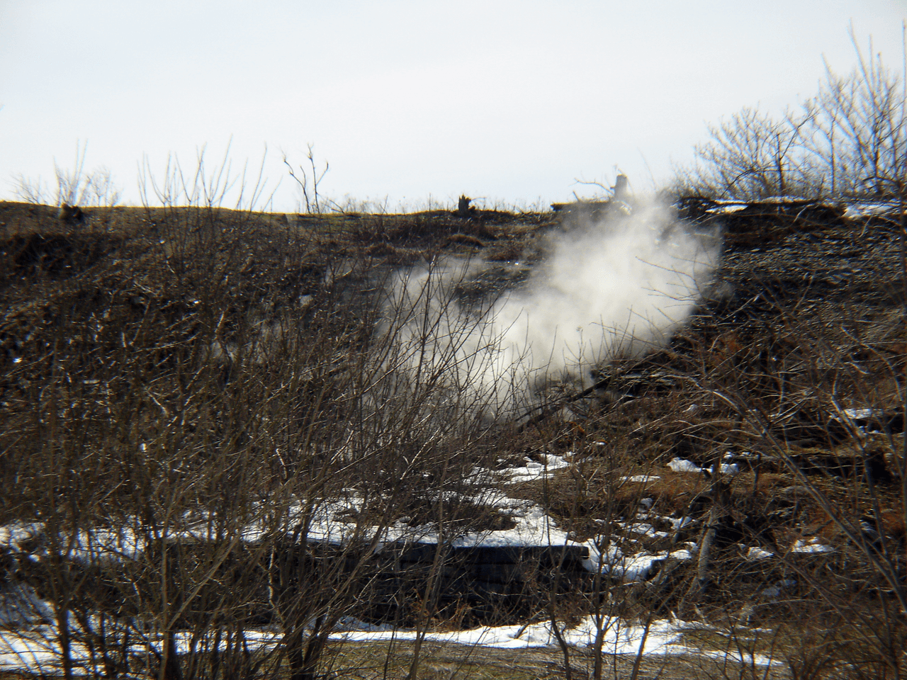 A plume rising from the ground. The fire burns at depths of up to three hundred feet.