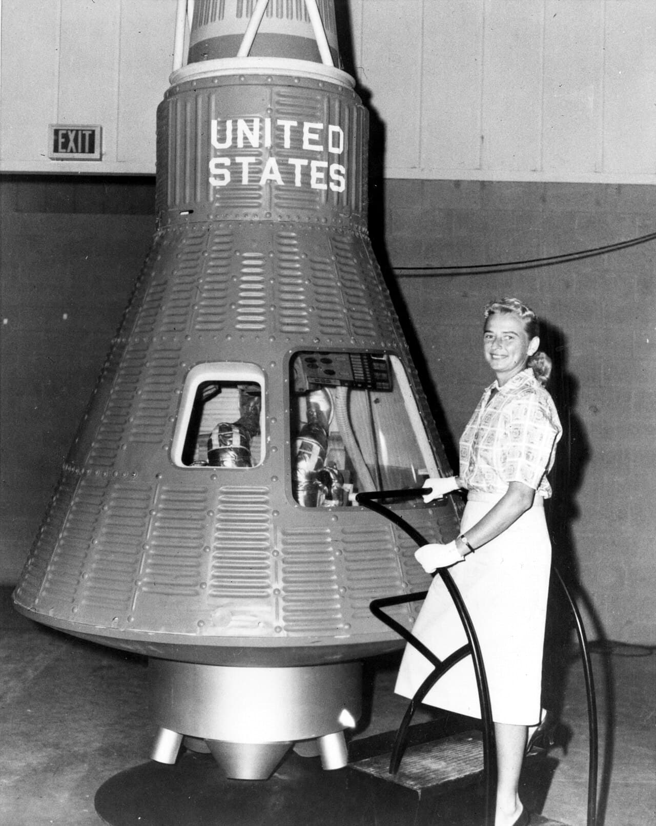 Jerrie Cobb beside a Mercury capsule. She was never a NASA astronaut candidate.